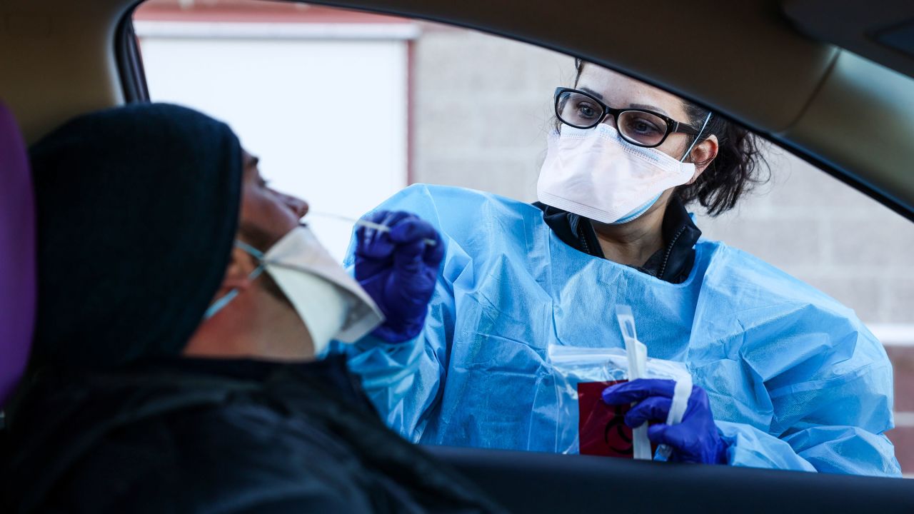 Pamela Deemie administers a Covid-19 test in Parker, Colorado, on December 30.