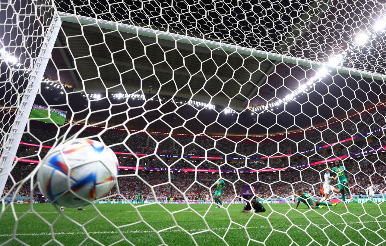England's?Jordan?Henderson?scores their first goal past Senegal's édouard Mendy at Al Bayt Stadium in Al Khor, Qatar on Sunday.