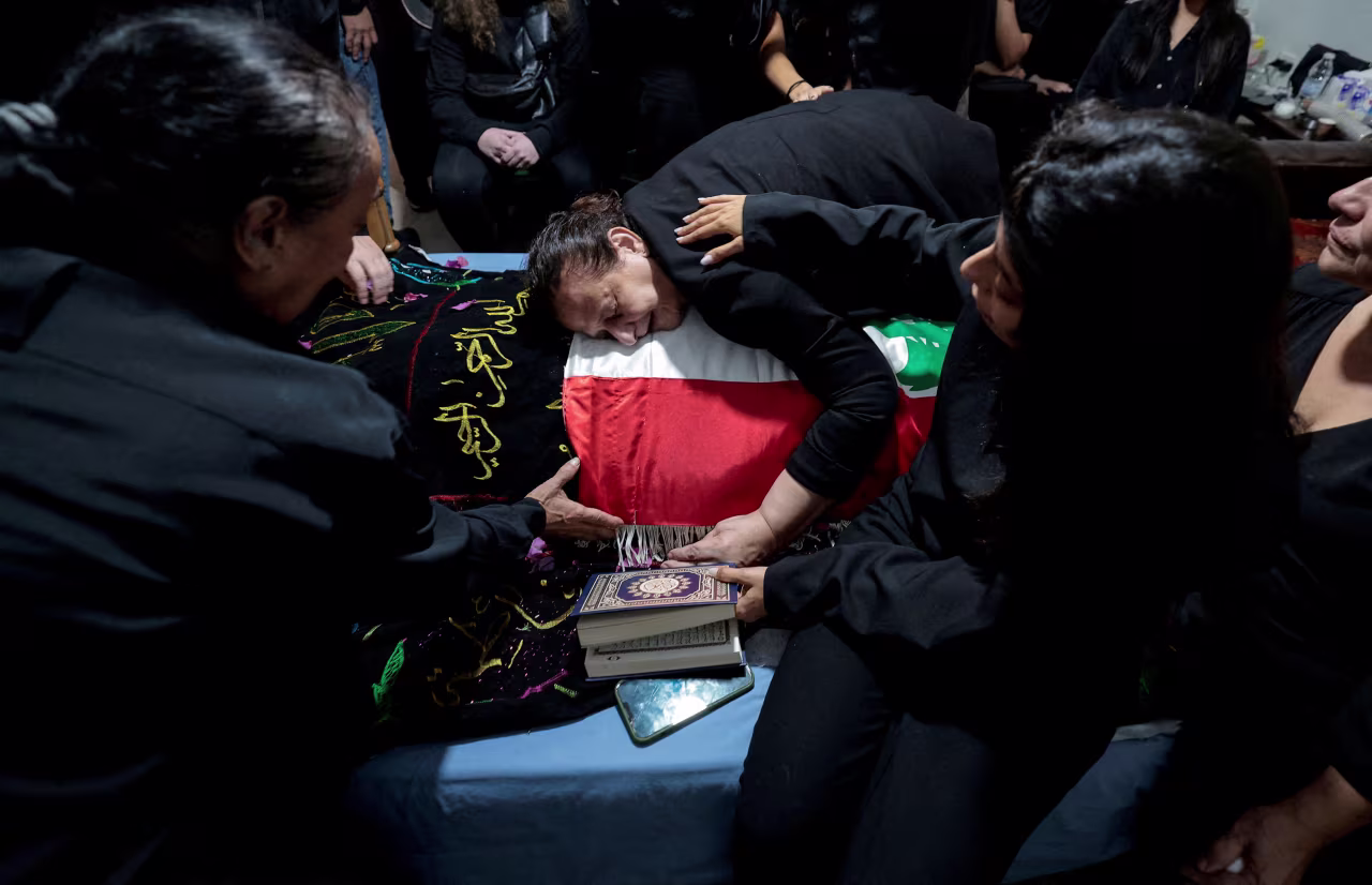 Fatma Kanso, mother of Issam Abdallah, mourns over her son's body during his funeral in his home town of Al Khiyam, Lebanon, on October 14. Abdallah was a Lebanese national and Reuters videojournalist who was killed in southern Lebanon by shelling from the direction of Israel.