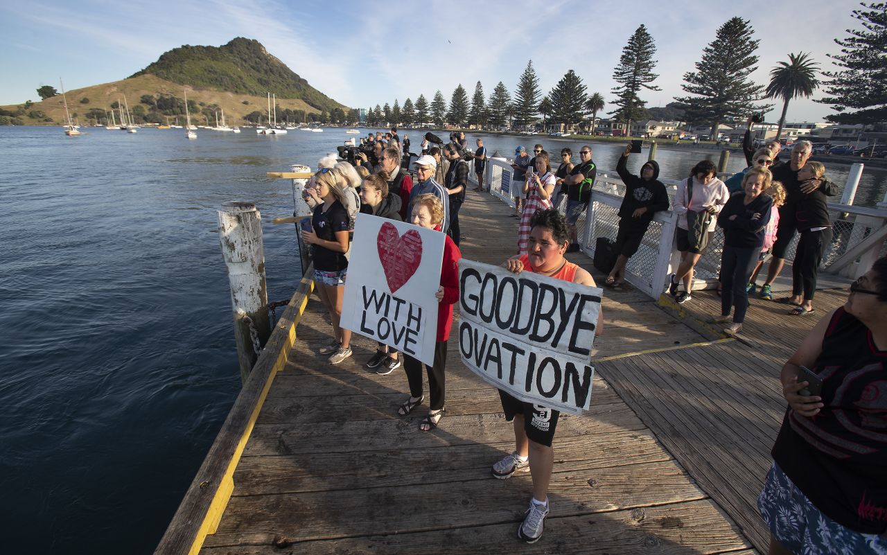 Locals gather to wave off the Ovation of the Seas cruise ship, which carried passengers who travelled to White Island when it erupted.