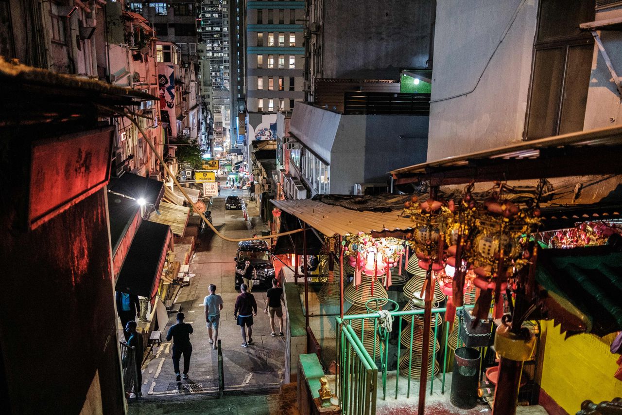 Pedestrians walk on the usually busy Peel Street, popular for its restaurants and bars in Hong Kong on March 23.