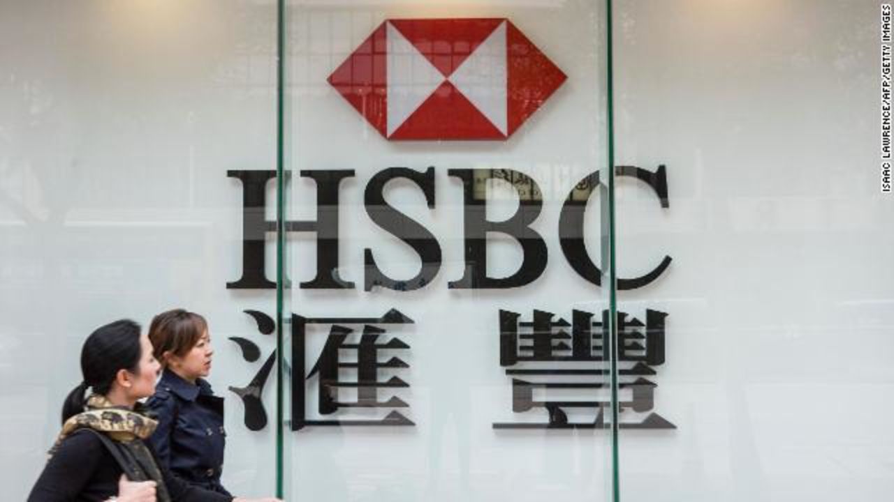 Pedestrians walk past HSBC in the Admiralty district of Hong Kong.