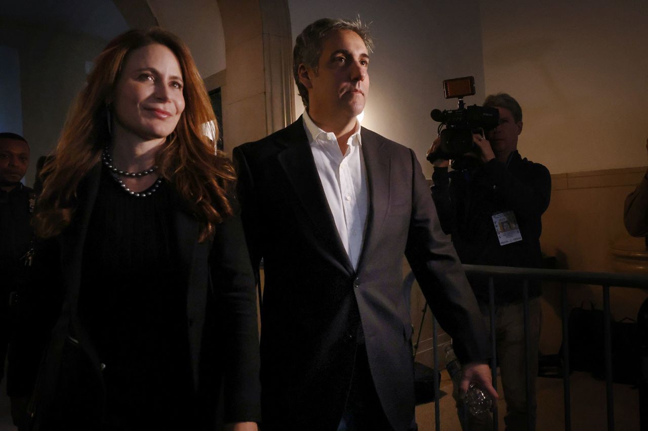 Michael Cohen, center, arrives at New York Supreme Court with his attorney on Wednesday, October 25.