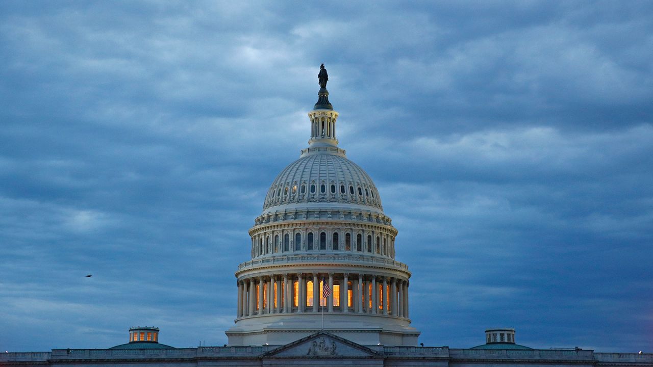 In this May 3, 2020 photo, light shines from inside the US Capitol dome at dusk on Capitol Hill in Washington.