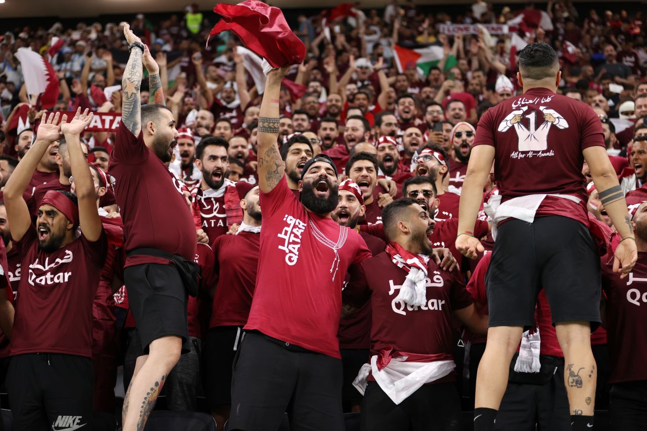 Qatar fans cheer inside Al Bayt Stadium.