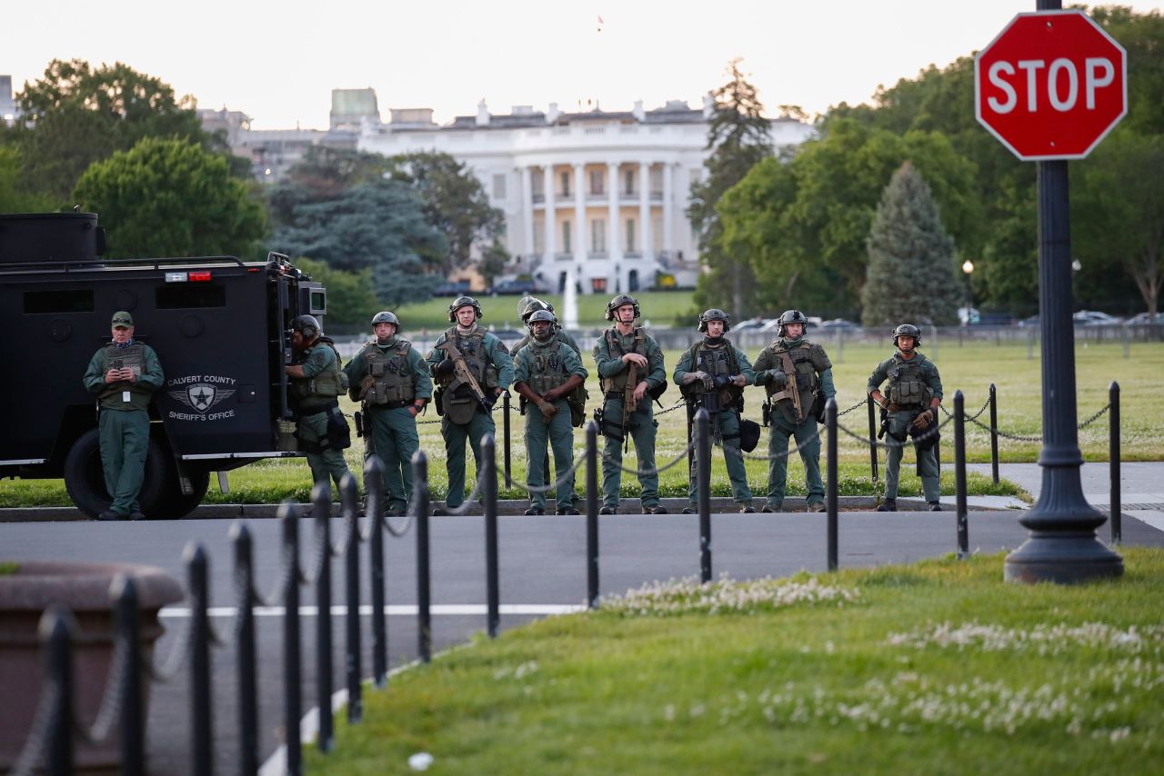 Law enforcement officers from Calvert County Maryland Sheriff's Office stand near the White House on May 31 in Washington.