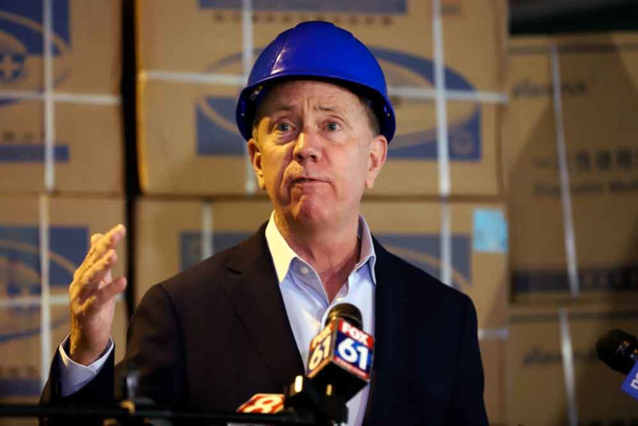 Connecticut Gov. Ned Lamont speaks to the media about the shipment of personal protective equipment from China donated to the state to aid Connecticut's frontline workers on Tuesday, May 12, in New Britain, Connecticut.