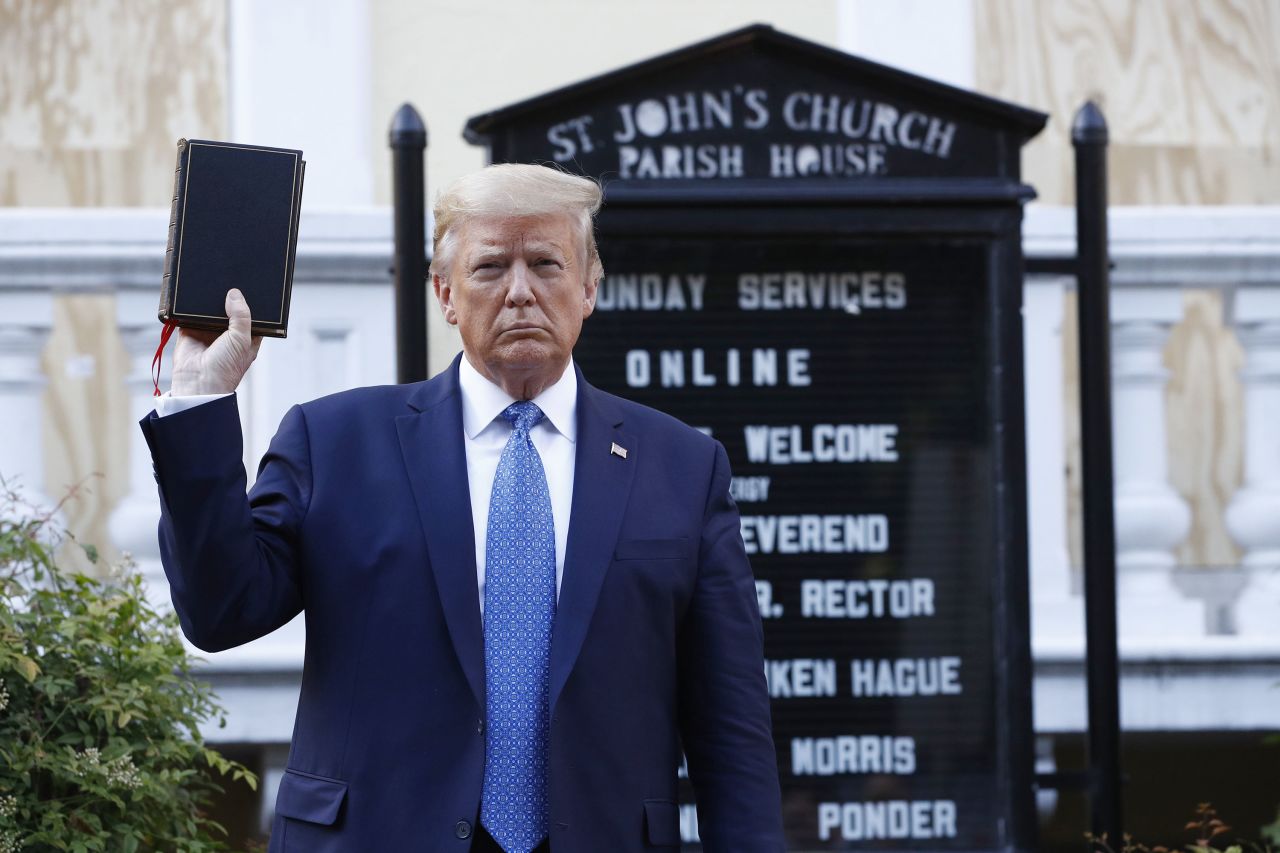 President Donald Trump holds a Bible as he visits outside St. John's Church across Lafayette Park from the White House Monday, June 1, 2020, in Washington.?