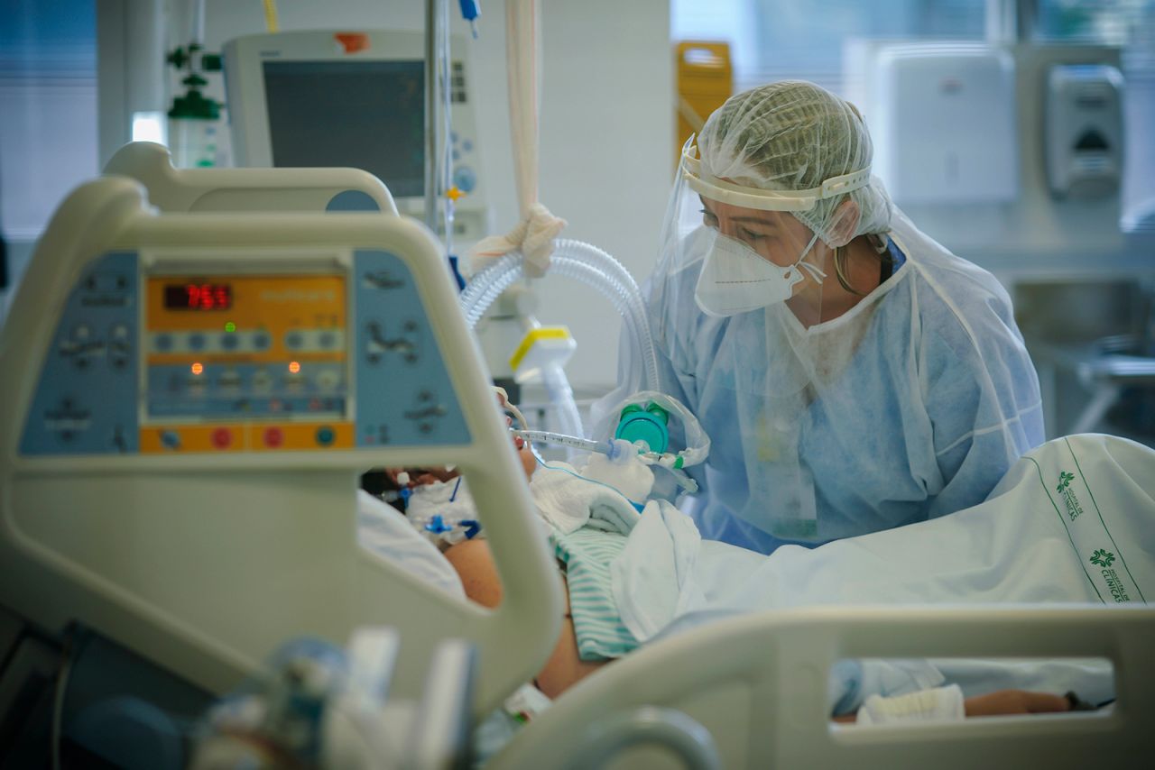 A health worker treats a Covid-19 patient in Porto Alegre, Brazil, on March 19.