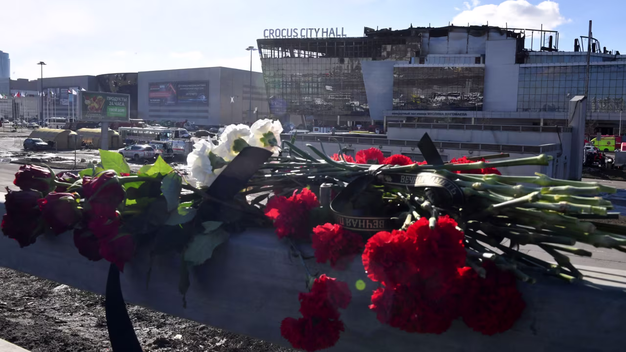 Flowers are left near the Crocus City concert hall on Monday.