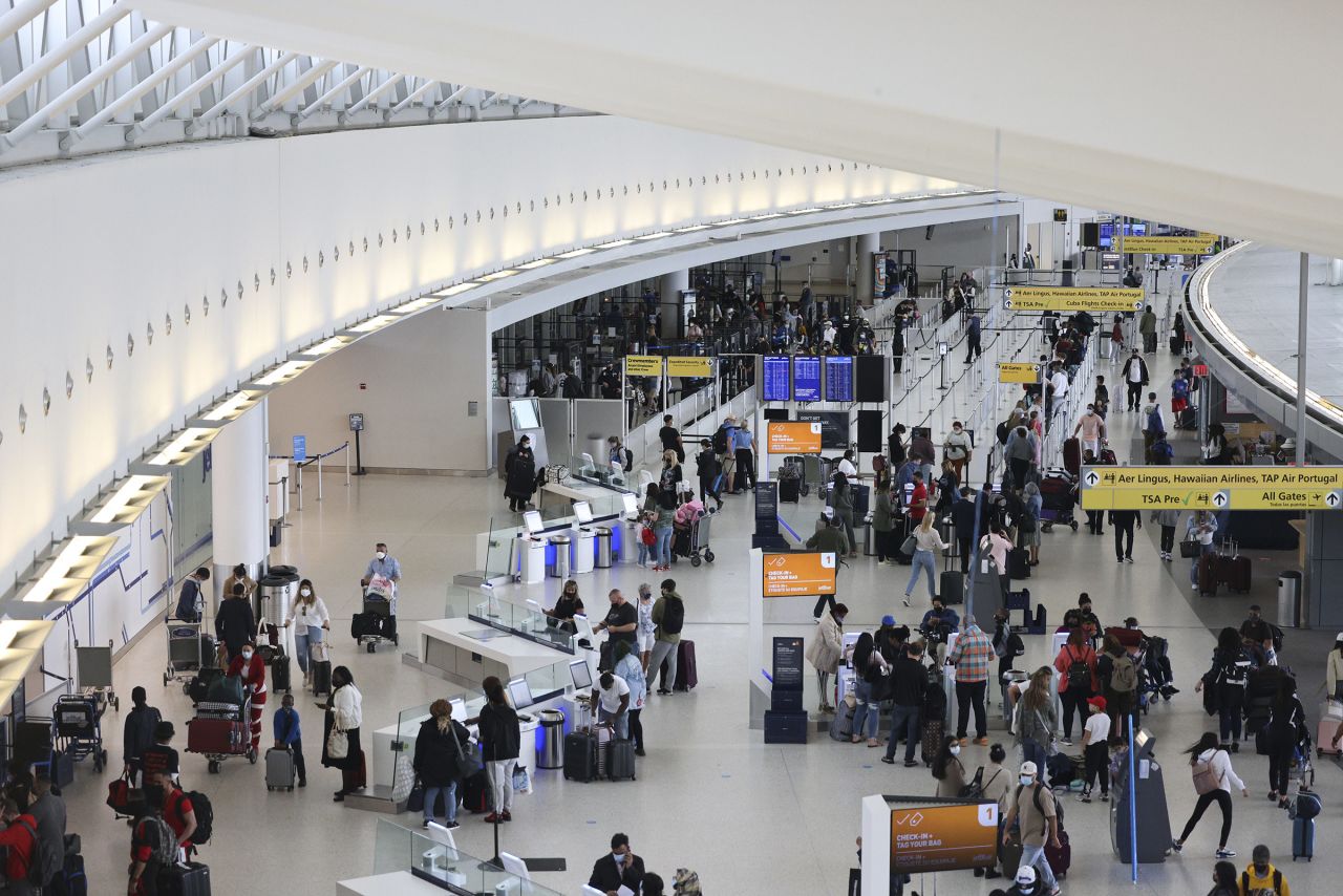 Travelers are seen at John F. Kennedy International Airport in New York, on Friday, March 26. 