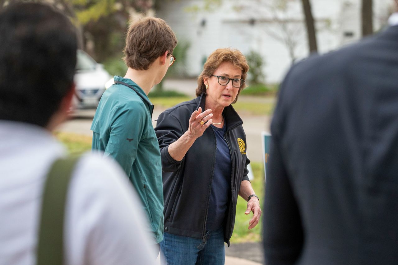 Harris County District Attorney Kim Ogg chats with media as she arrives with her son Jack Jordan to cast their ballots for her own primary race at the Love Park Community Center polling location Tuesday, March 5 in Houston. 