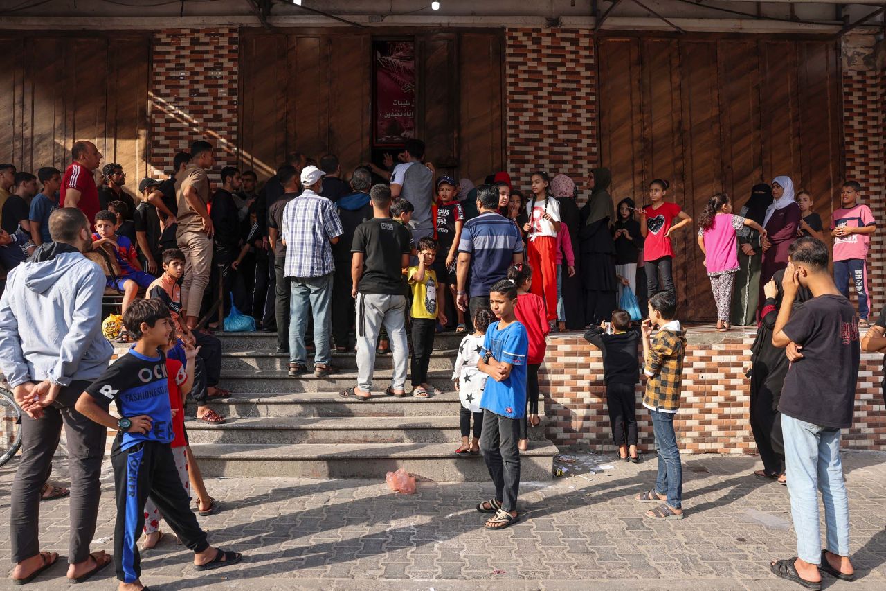 People queue outside a bakery in Rafah, Gaza on October 22. 