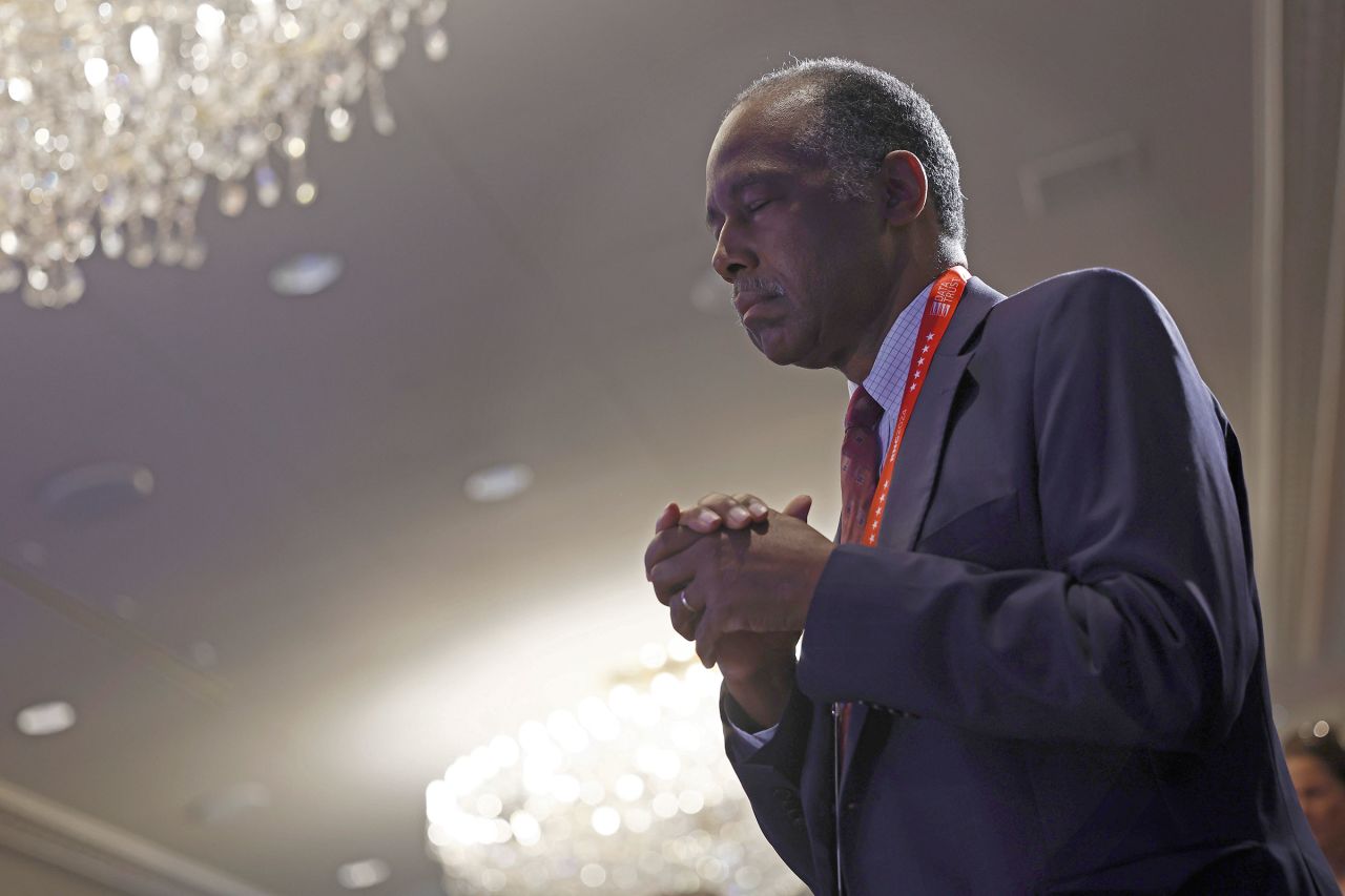 Dr. Ben Carson prays during the Faith & Freedom Coalition’s "God & Country Breakfast" at the Pfister Hotel, on July 18, in Milwaukee, Wisconsin.