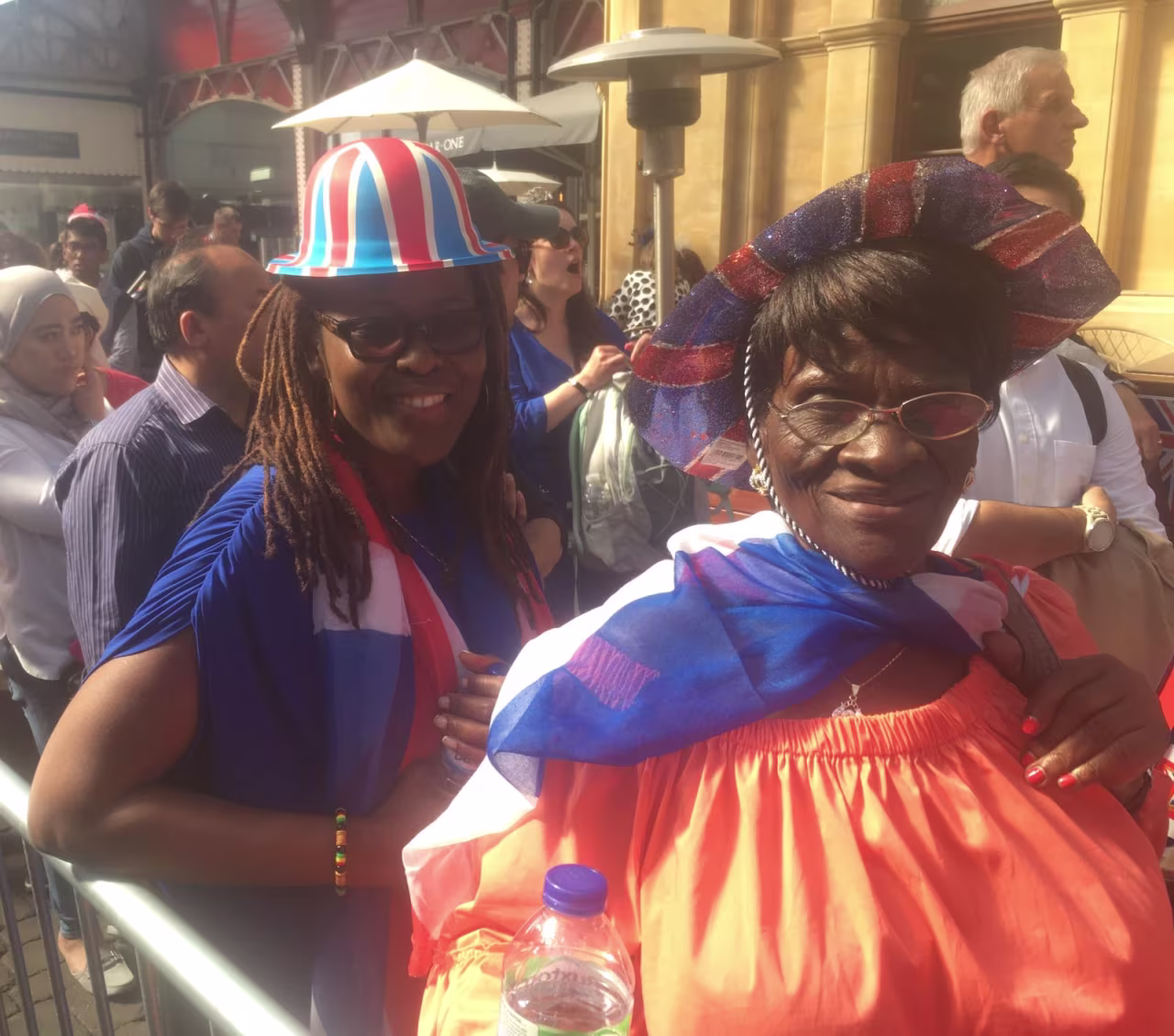 Tiful, left and her mother, Monica, right, traveled from the US and Cameroon respectively to be part of Prince Harry and Meghan's day.
