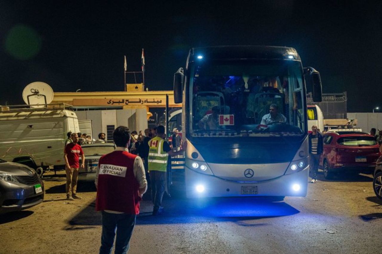 A bus carrying Canadian nationals recently evacuated from Gaza prepares to depart the Rafah crossing on November 12. 