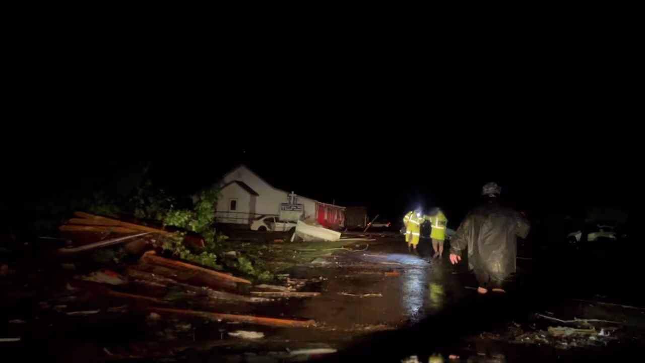 Emergency responders work amid storm damage in Barnsdall, Oklahoma.