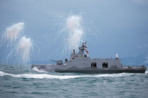 A Taiwan Navy Tuo Chiang-class corvette shoots decoy flares during a military exercise off the shore in Keelung, Taiwan, on Jan. 7.