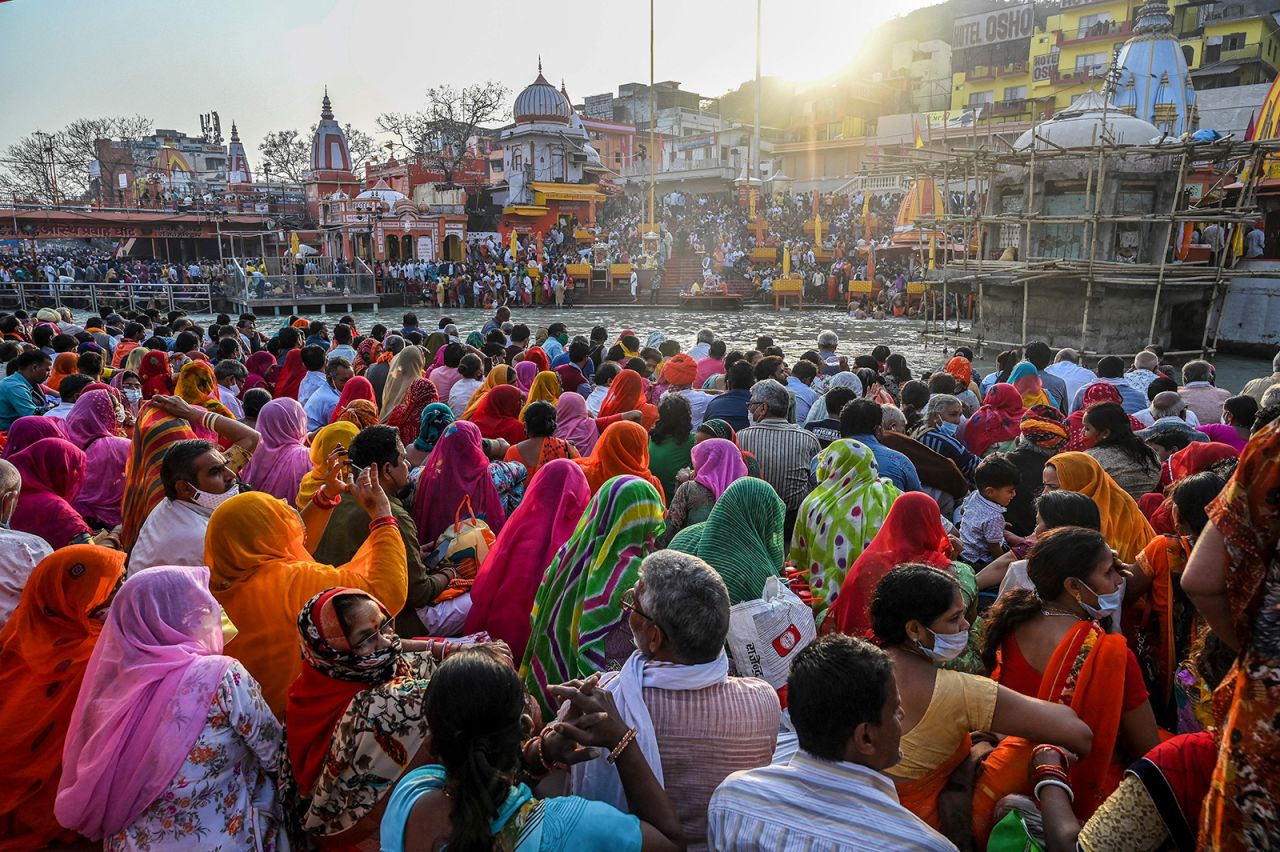 Hindu devotees gather for evening prayers after taking a holy dip in the waters of the River Ganges on the eve of Shahi Snan (grand bath) on Maha Shivratri festival during the ongoing religious Kumbh Mela festival in Haridwar, India, on March 10