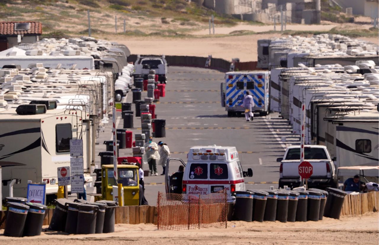 Medical personnel work at an RV park at Dockweiler State Beach where some coronavirus patients are being quarantined on Friday, April 3, in Los Angeles. 