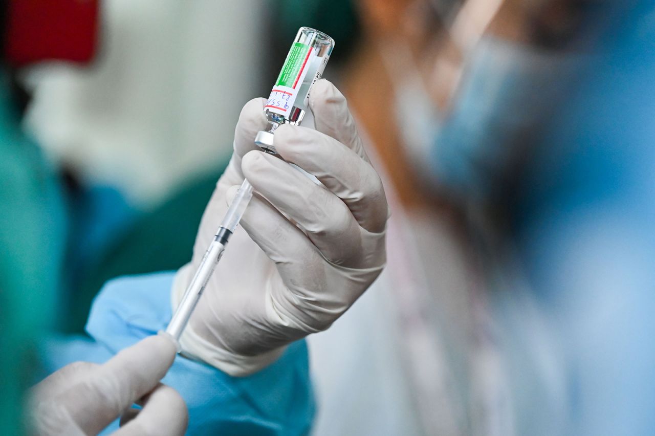 A health worker holds up a vial of AstraZeneca-Oxford's Covid-19 coronavirus vaccine on January 27.