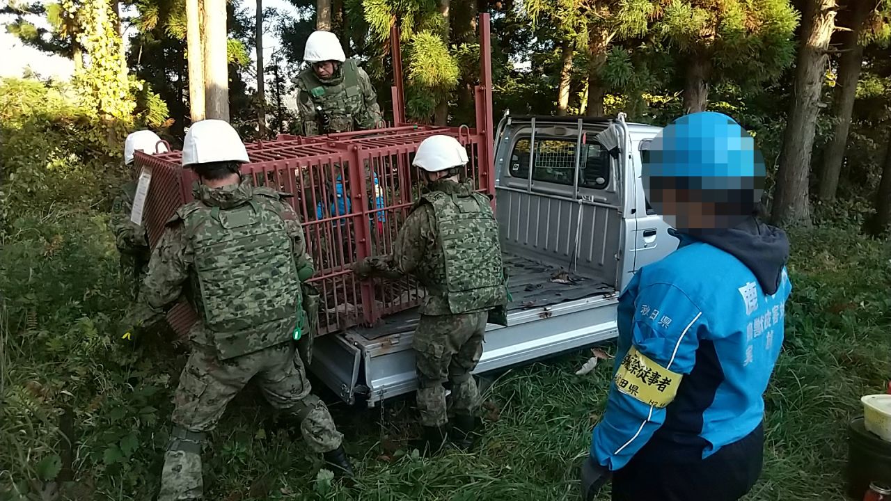 Japan's Ground Self-Defense Force (GSDF) soldiers help transport and set up bear traps in Kazuno City, Akita prefecture, on November 5, 2025. Portions of this photo were blurred by Japan Ground Self-Defense Force.