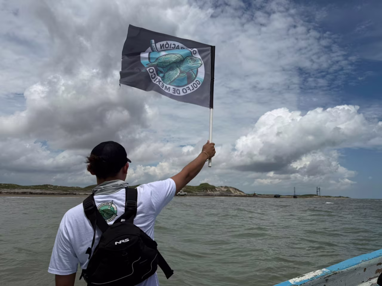 Conibio Global stages a peaceful protest against the SpaceX Starship launch attempt near Brownsville, Texas, on Sunday.