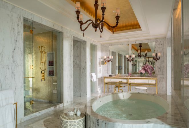 The enormous marble tub and expansive terrace overlooking the resort’s palm-fringed pool and the Arabian Gulf are highlights in this one-bedroom penthouse suite.