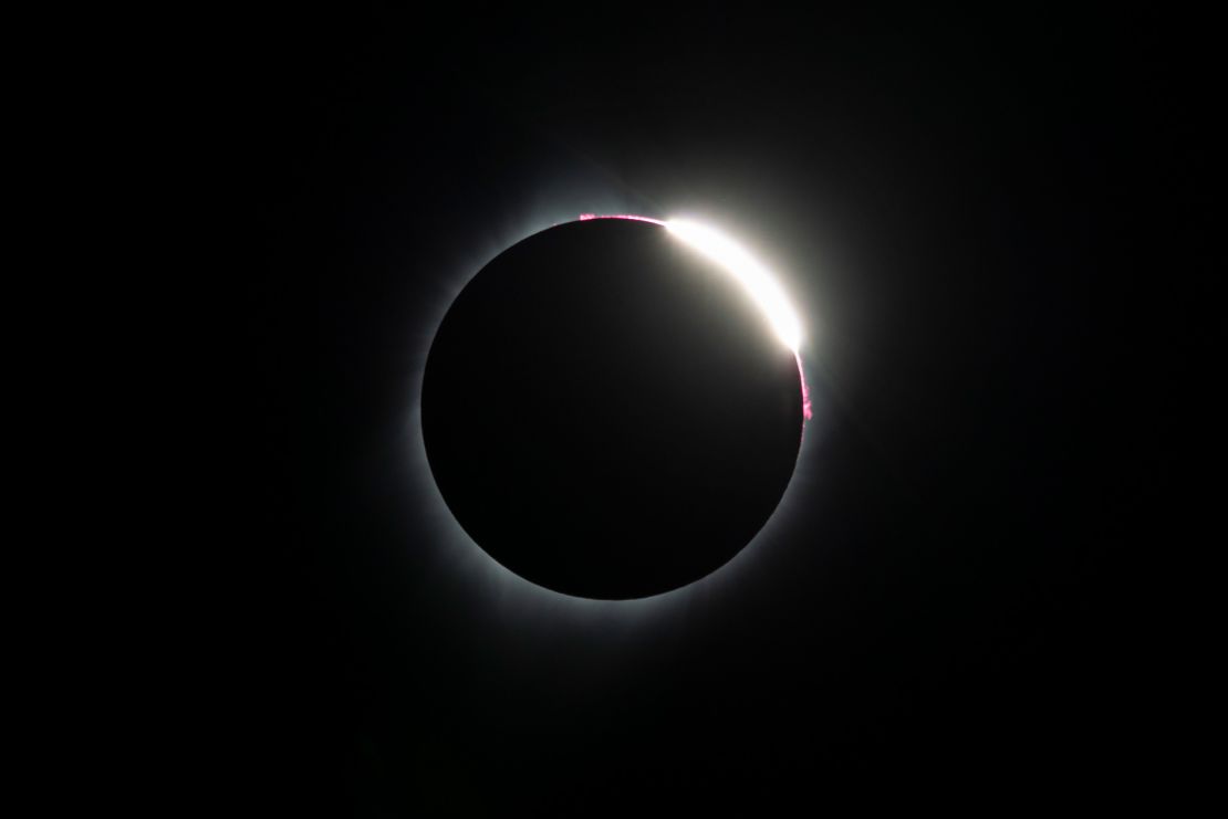 The "diamond ring" effect happens just before the moon completely covers up the sun. Here's an example from the total solar eclipse in 2017, as photographed from Madras, Oregon.