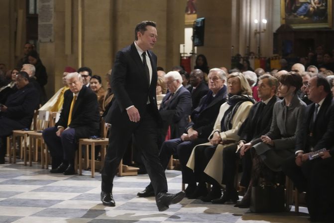 Musk arrives at Paris' Notre Dame Cathedral in December 2024 as France's iconic cathedral formally reopened its doors for the first time since a devastating fire nearly destroyed the landmark in 2019. Trump, seen on the left, <a href=