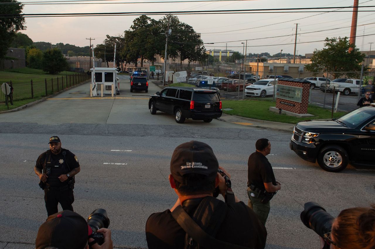 Former President Donald Trump arrives outside of the Fulton County Jail in Atlanta, Georgia, on Thursday, August 24, 2023.