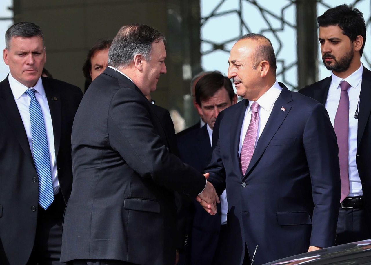 US Secretary of State Mike Pompeo and Turkish Foreign Minister MevluCavusoglu shake hands after their meeting at Ankara Esenboga Airport in Ankara, Turkey, on Wednesday. 