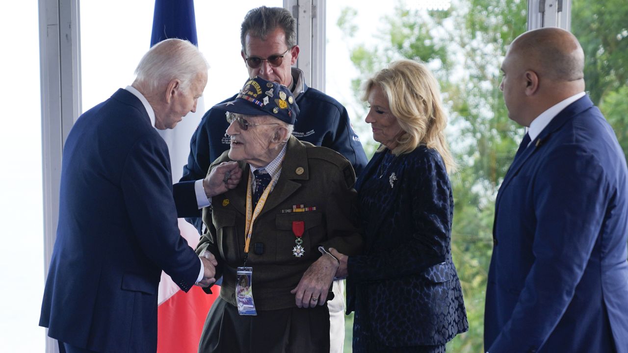 President Joe Biden and first lady Jill Biden, greet a World War II veteran during ceremonies to mark the 80th anniversary of D-Day, on June 6.