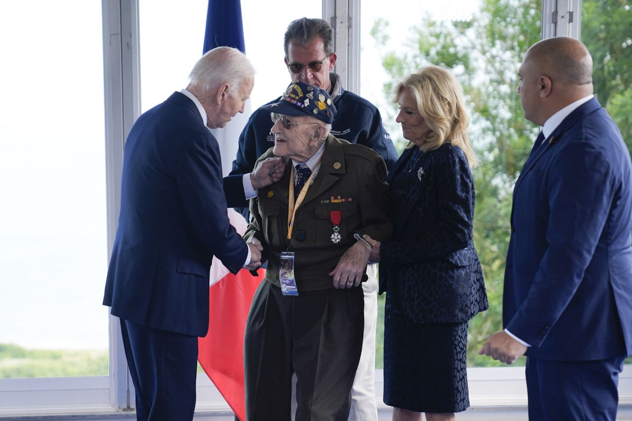 President Joe Biden and first lady Jill Biden, greet a World War II veteran during ceremonies to mark the 80th anniversary of D-Day, on June 6.