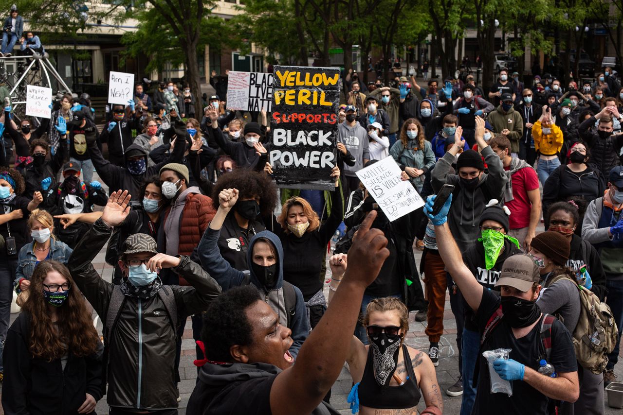 Demonstrators chant during a gathering on May 31, in Seattle.