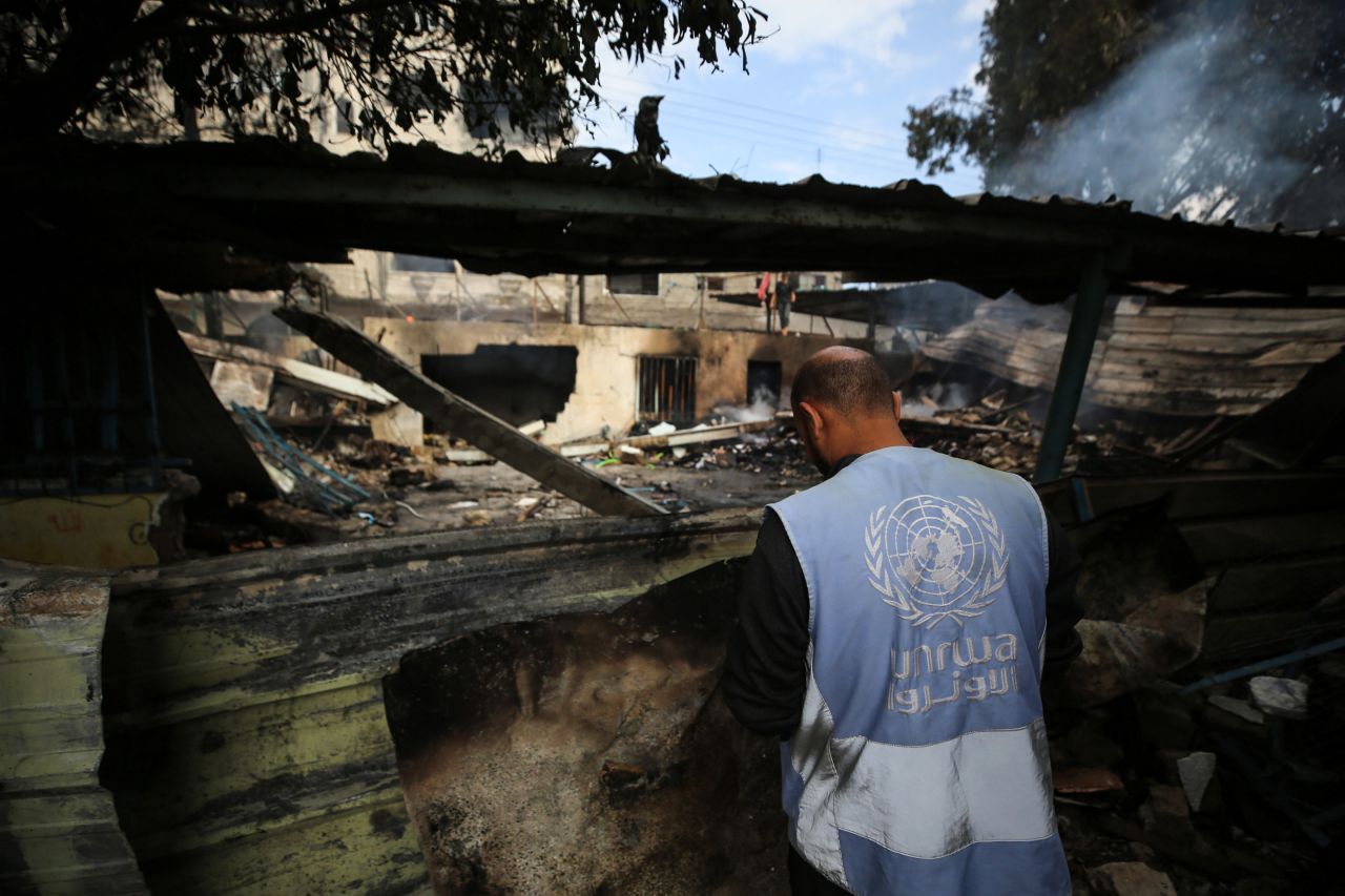 An employee of UNRWA looks at the site of an Israeli strike on a school in Nuseirat, Gaza, on Tuesday.