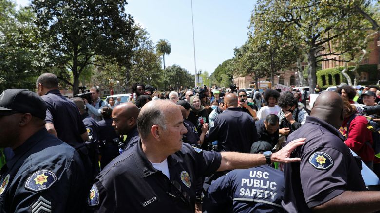 USC Safety officers try to disperse protestors at the University of Southern California's Alumni Park in Los Angeles on Wednesday, April 24.
