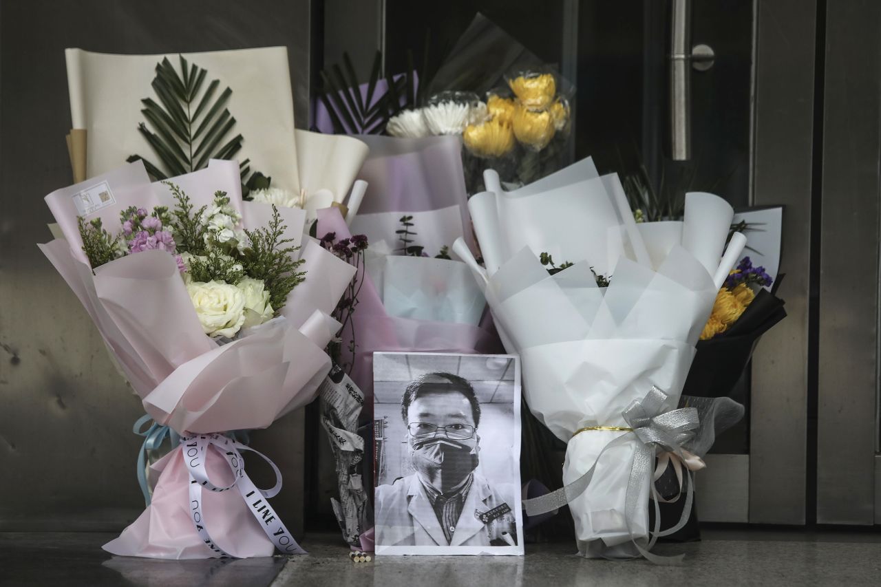 A portrait of Dr. Li Wenliang is left at Li's hospital in Wuhan on Friday.