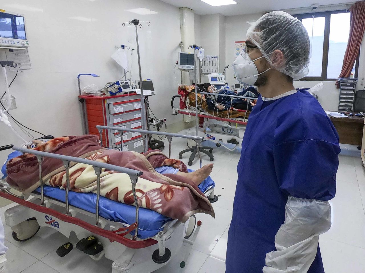 A nurse cares for patients in a ward dedicated to people infected with the coronavirus at Forqani Hospital in Qom, Iran, on February 26.