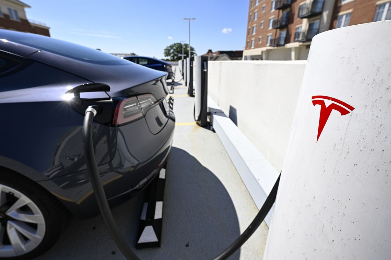 A Tesla logo is seen at a charger station in Virginia, United States on August 16.