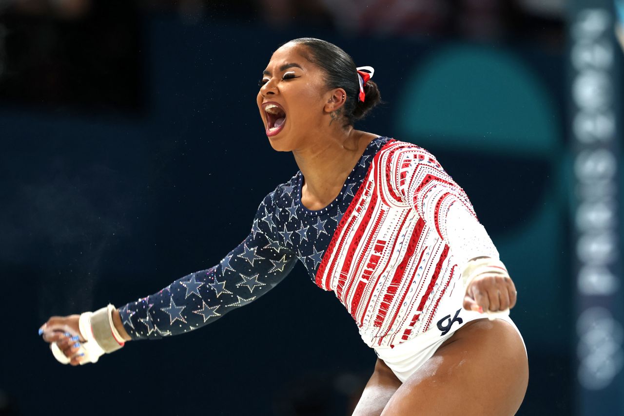 Jordan Chiles reacts after finishing her routine on the uneven bars on Tuesday.
