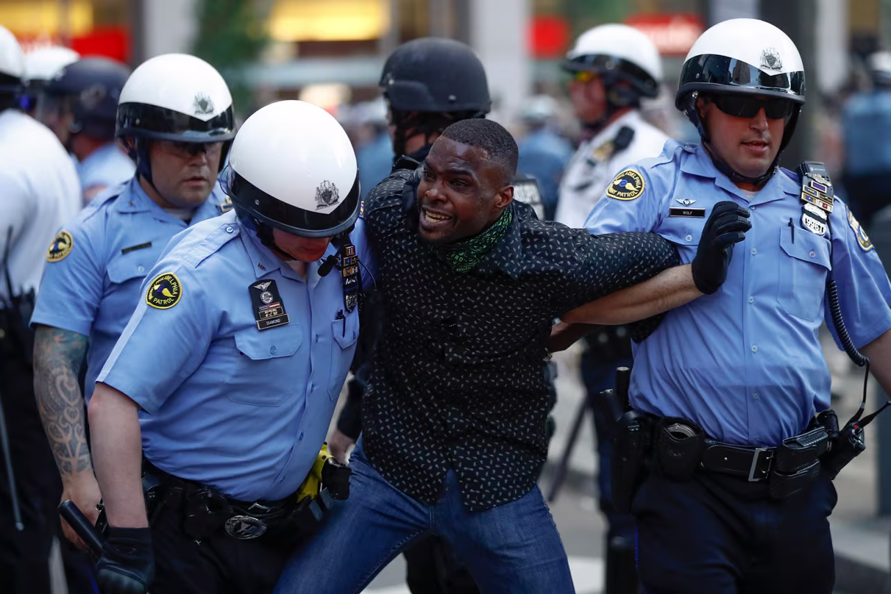 Philadelphia police restrain a man during the Justice for George Floyd Philadelphia Protest on Saturday, May 30.