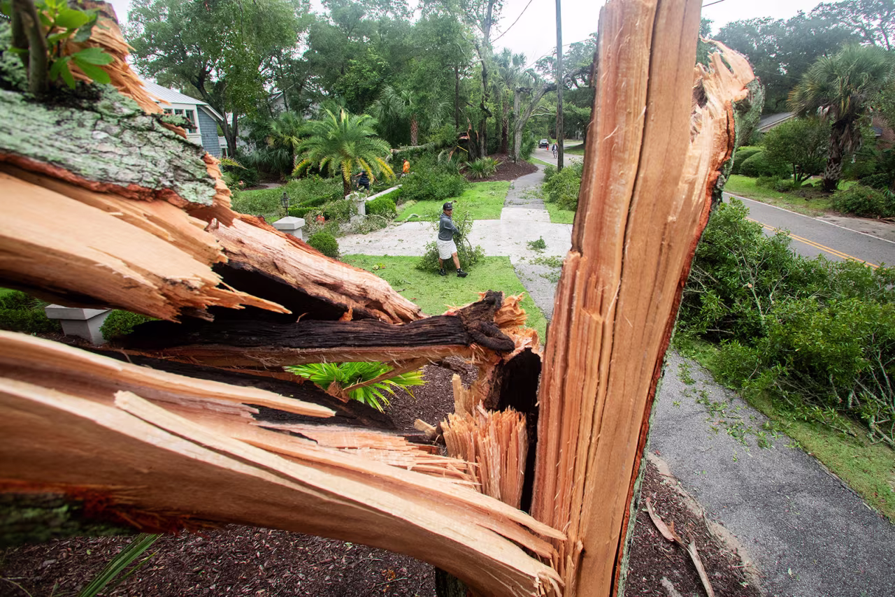 A worker cleans debris from a possible tornado after an outer band from Tropical Storm Debby passed over the Isle of Palms, South Carolina, on August 6.