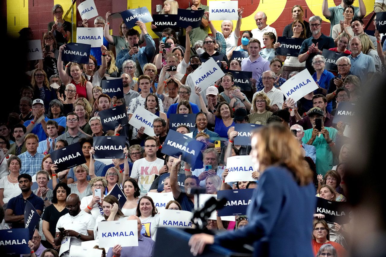 Attendees hold signs as Vice President Kamala Harris speaks during a campaign event in Milwaukee on Tuesday, July 23