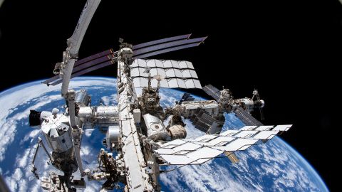 iss066e085461 (Dec. 2, 2021) --- This view from NASA spacewalker Thomas Marshburn's camera points downward toward the International Space Station with the Earth 265 miles below him. Marshburn was attached to the Canadarm2 robotic arm during a six-hour and 32 minute spacewalk to replace a failed antenna system on the orbiting lab's Port-1 truss structure.