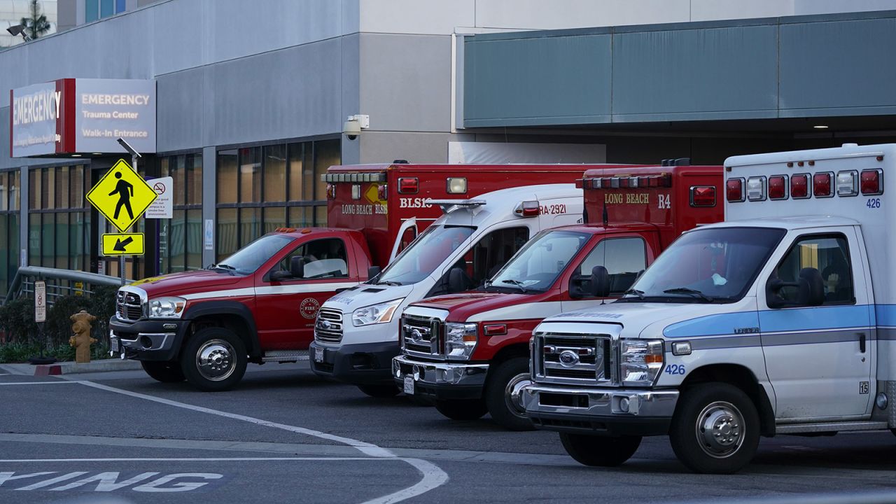 Ambulances are parked outside an emergency room entrance at Long Beach Medical Center Tuesday, January 5, in Long Beach, California.