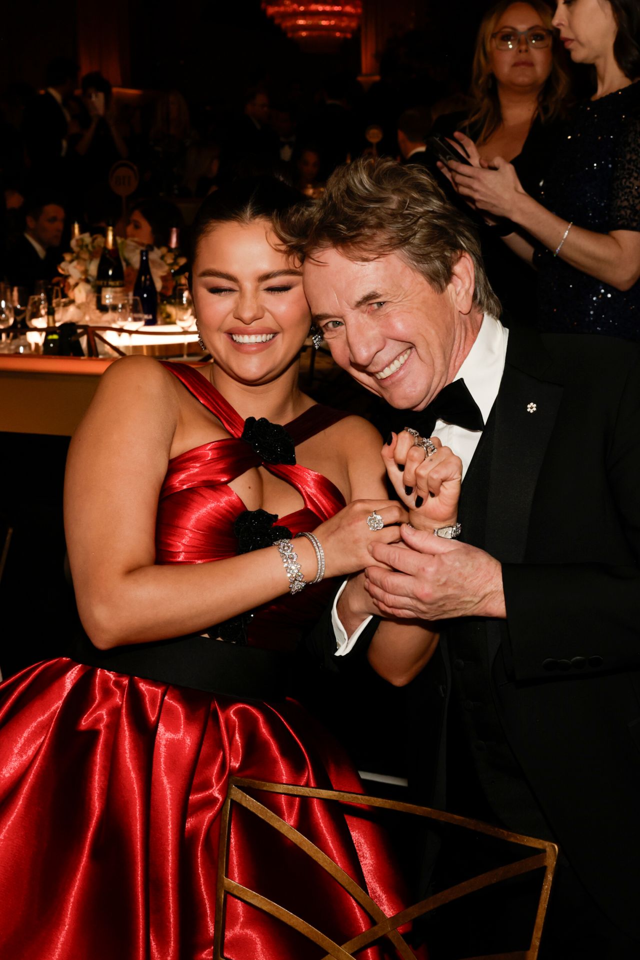 Selena Gomez and Martin Short embrace. 