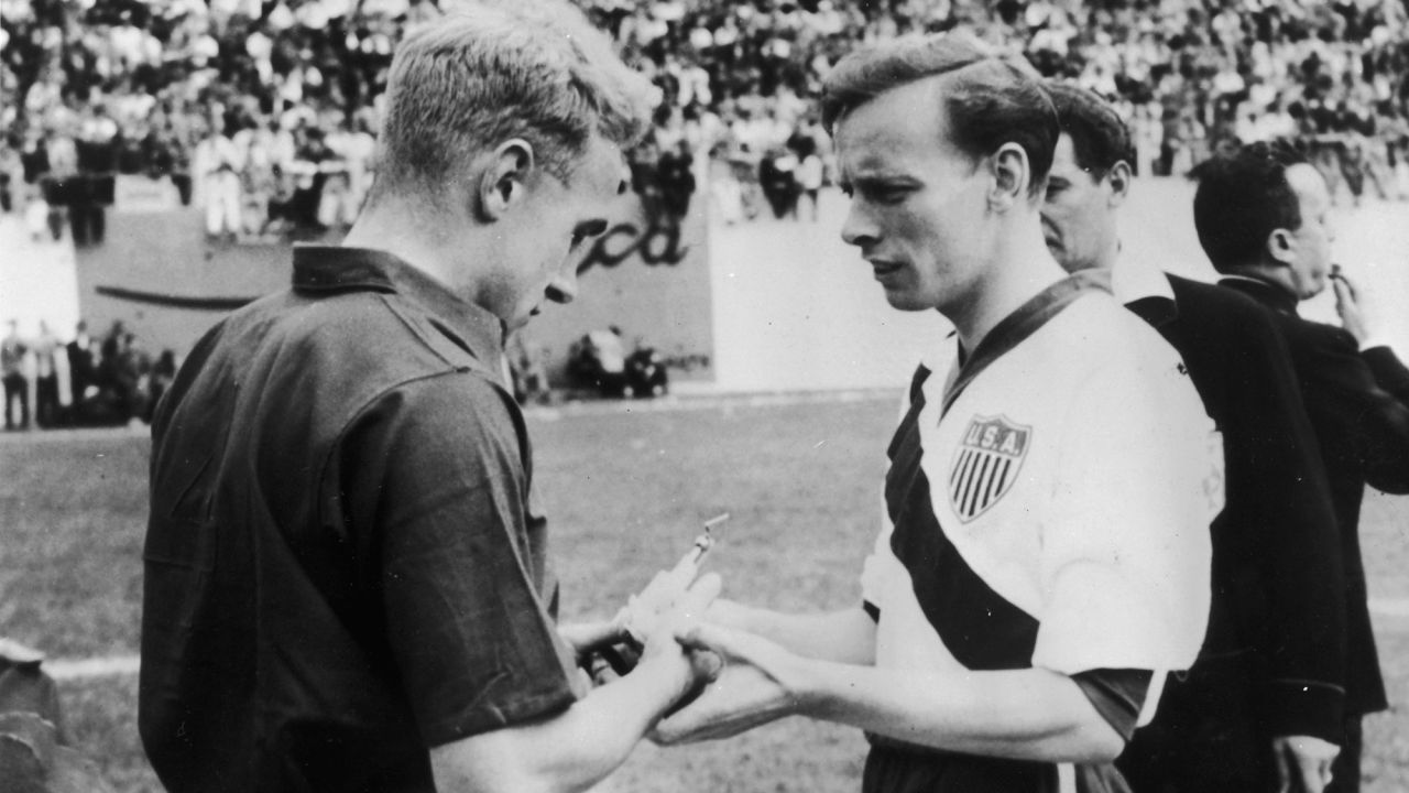 England captain Billy Wright, left, exchanges souvenirs with US captain Ed McIlvenny at the start of their World Cup match in 1950.