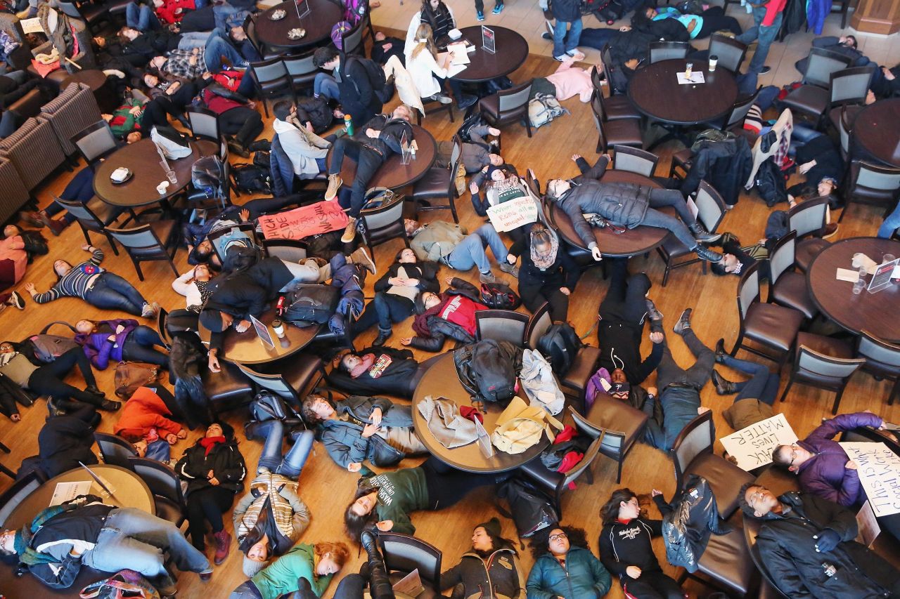 Students stage a "die in" at Washington University to draw attention to police violence against unarmed Black men on December 1, 2014, in St. Louis, Missouri. 