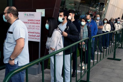 Frontline medical workers stand in line to get the Pfizer-BioNTech COVID-19 vaccine during a nationwide vaccination program at the American University Medical Center in Beirut, Lebanon, on February 14.